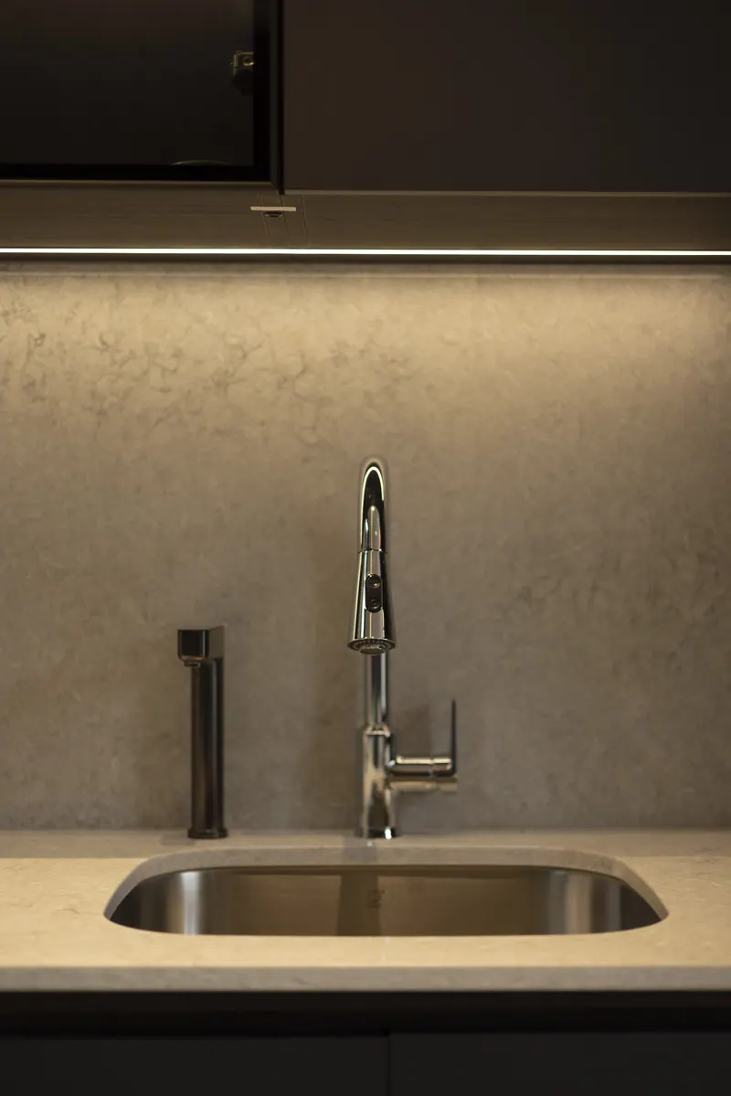 Undermount kitchen sink with a pull-down faucet