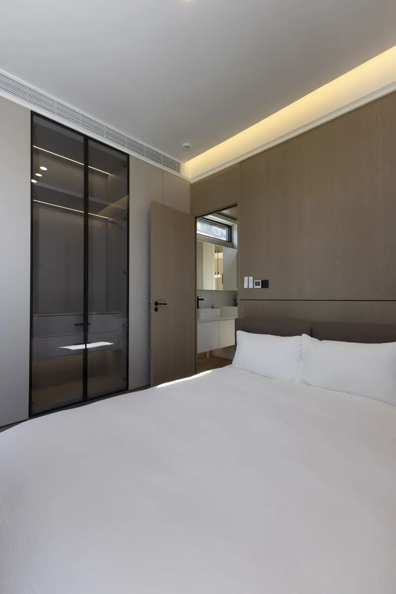 Solace bedroom seen from the bed toward the glass closet