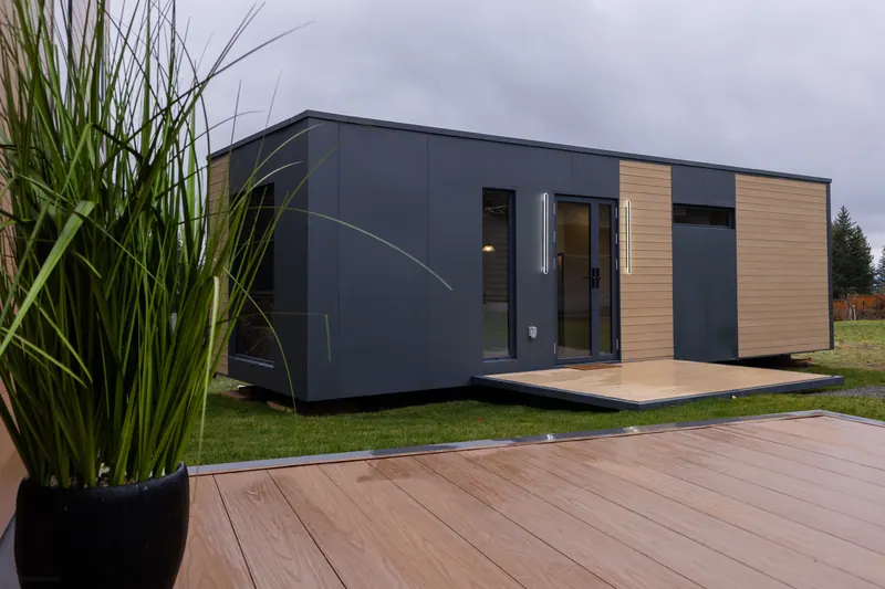 A show home from outside with its door lights on