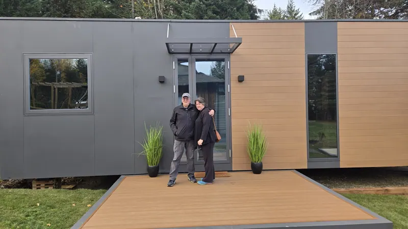 A couple embracing at the entrance of a show home
