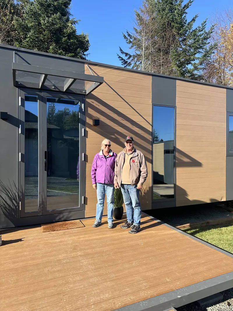A couple standing at the entrance of a show home