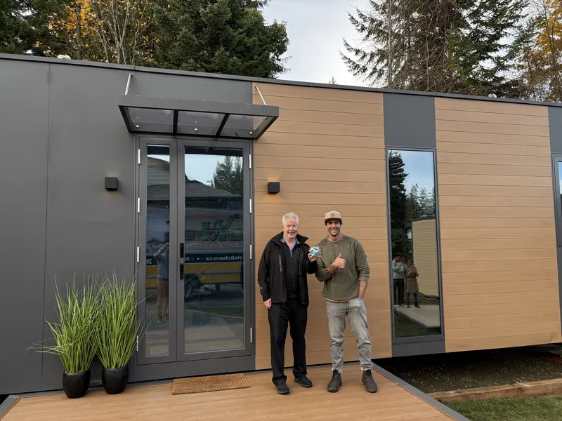 Two visitors at the entrance of a show home